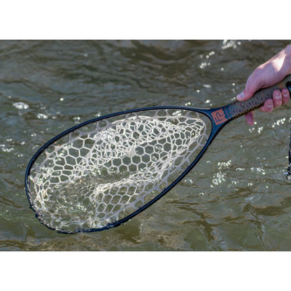 Close-up of Fishpond Nomad Native Net in water showing orange logo on handle